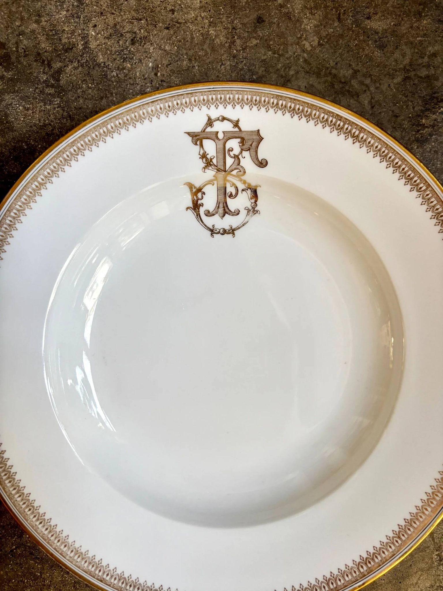 Gold monogrammed porcelain deep plate "F"