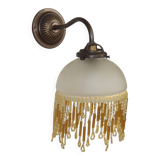 French vintage bronze effect single wall light with opaque beaded glass shade.