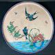 Round polychrome enamel dish with bird decoration circa 1900