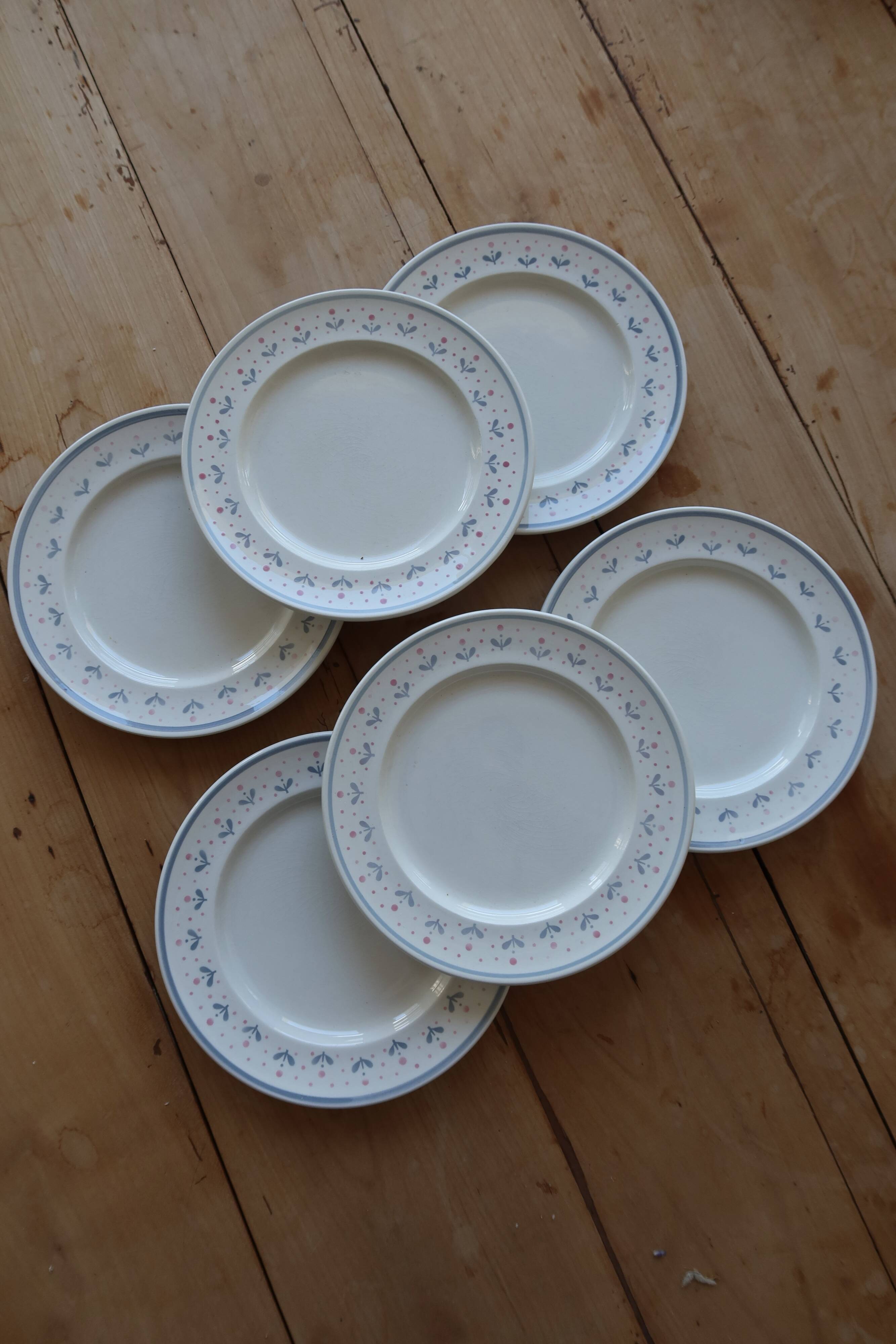6 vintage dessert plates stamped Longchamp with floral border