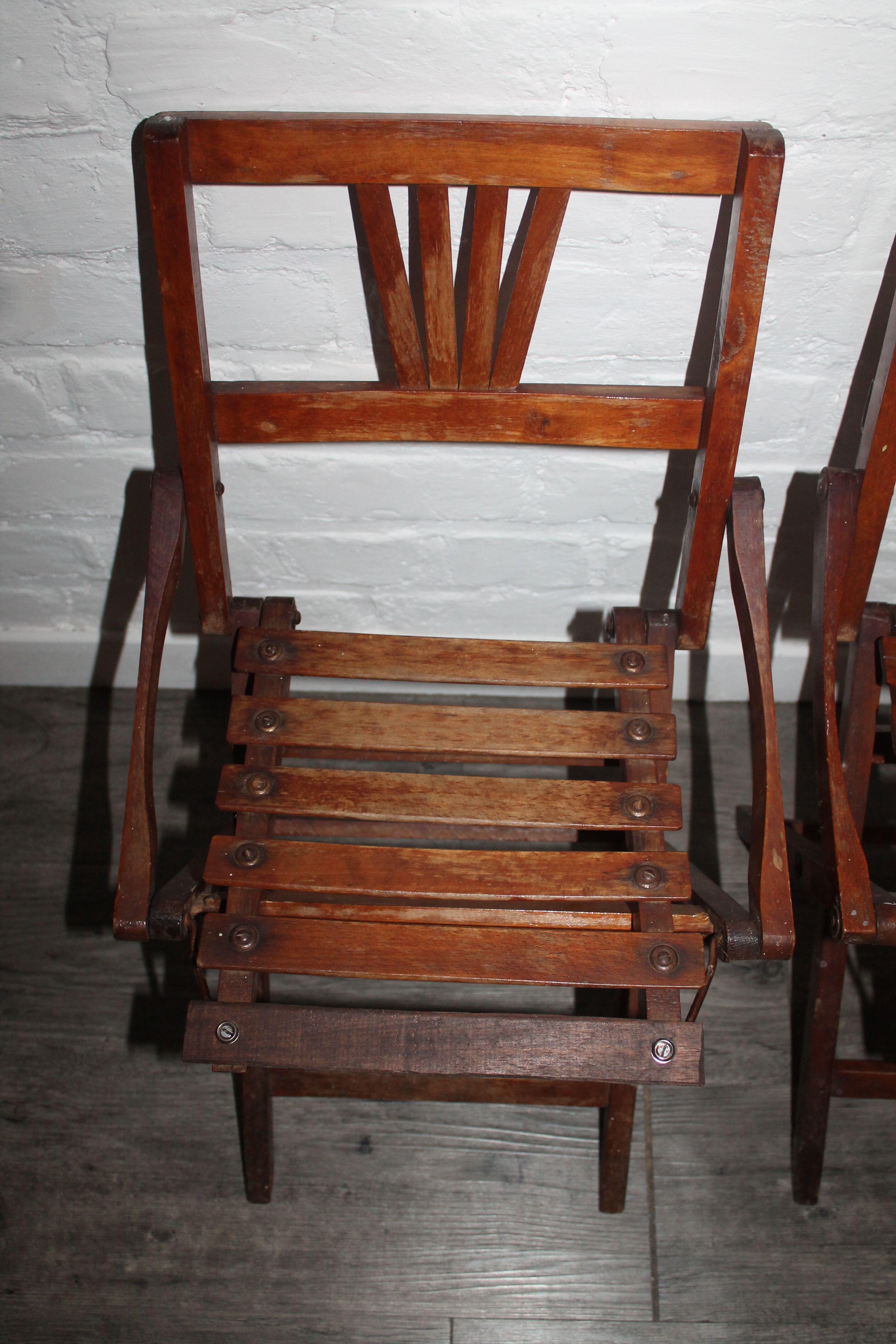 2 wooden folding chairs