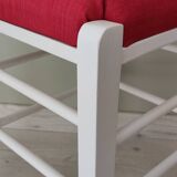 White pine stool with a red seat.