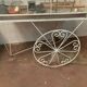 Cage has birds on trolley wheeled wrought iron volière 20th century
