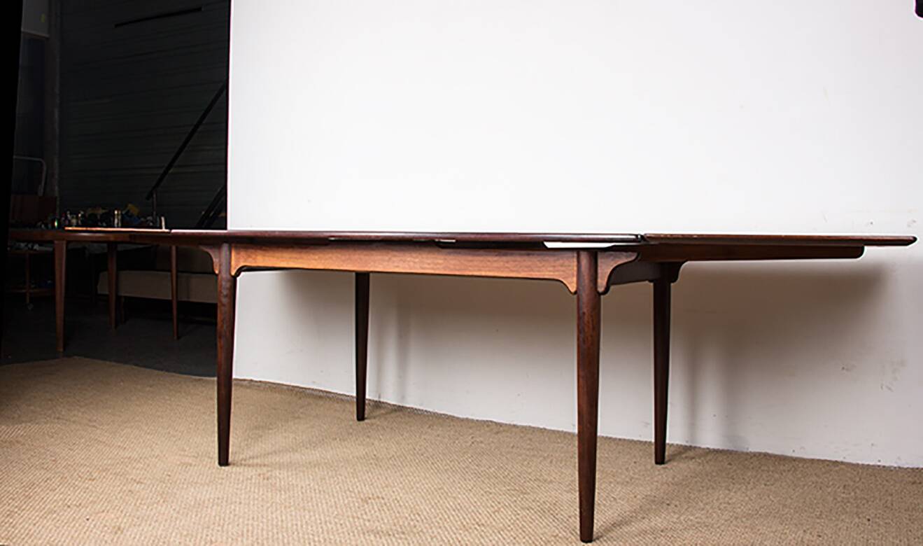 Danish extendable dining table in rosewood, model 54 by Gunni Omann