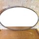 Oval Art Deco mirror with vintage chrome frame from the 1970s.