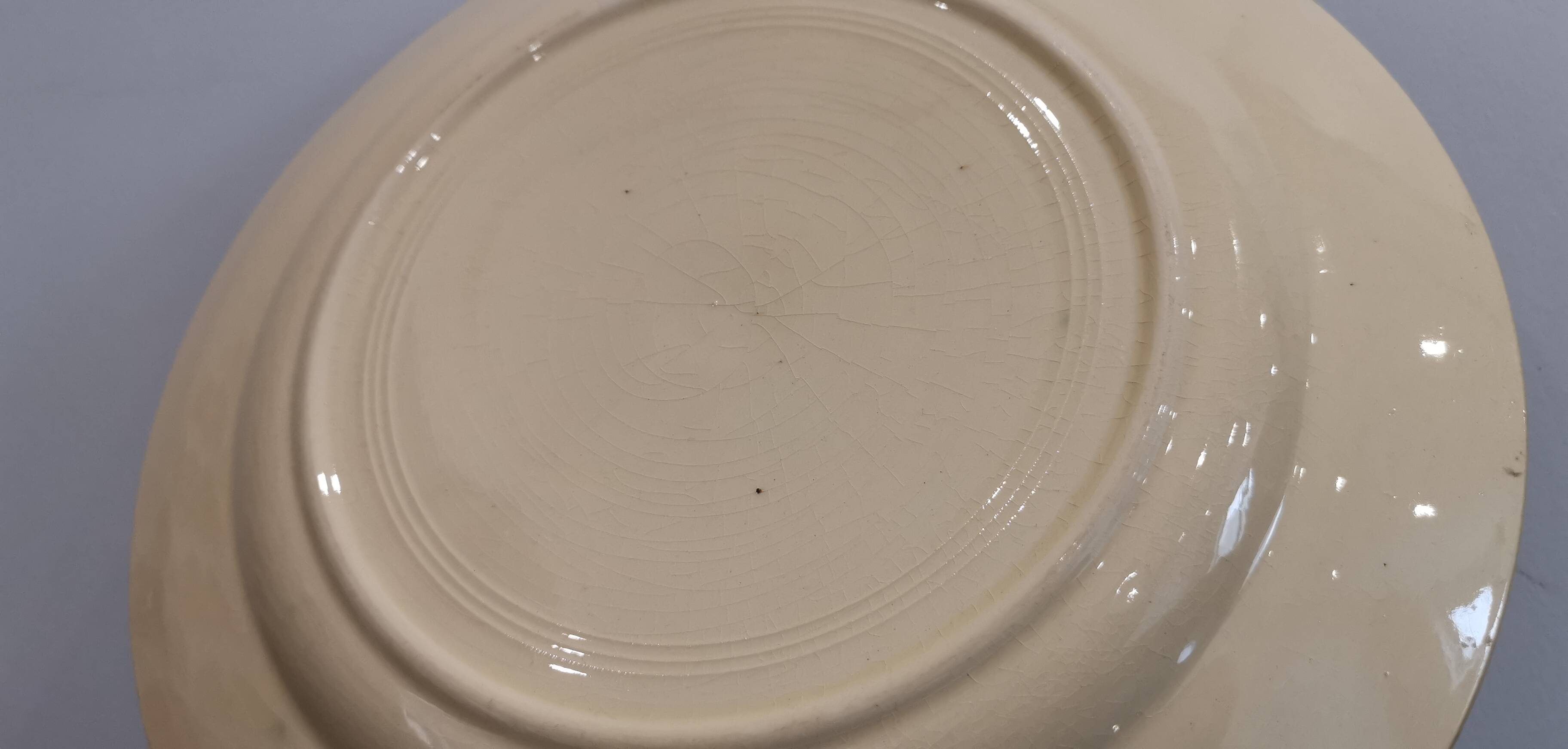 Old Terre de fer earthenware dish, hand painted
