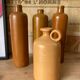 Suite de 4 bouteilles en grès