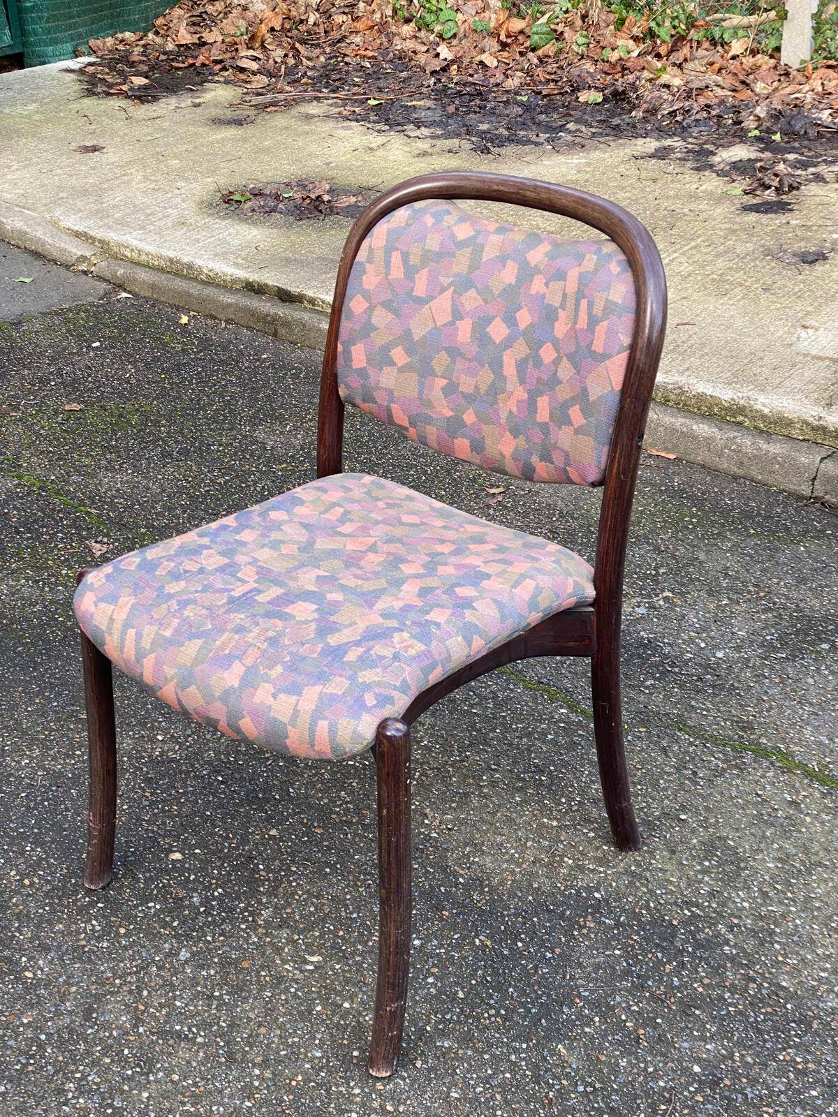Scandinavian chair in curved solid teak wood and fabric.