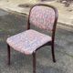 Scandinavian chair in curved solid teak wood and fabric.