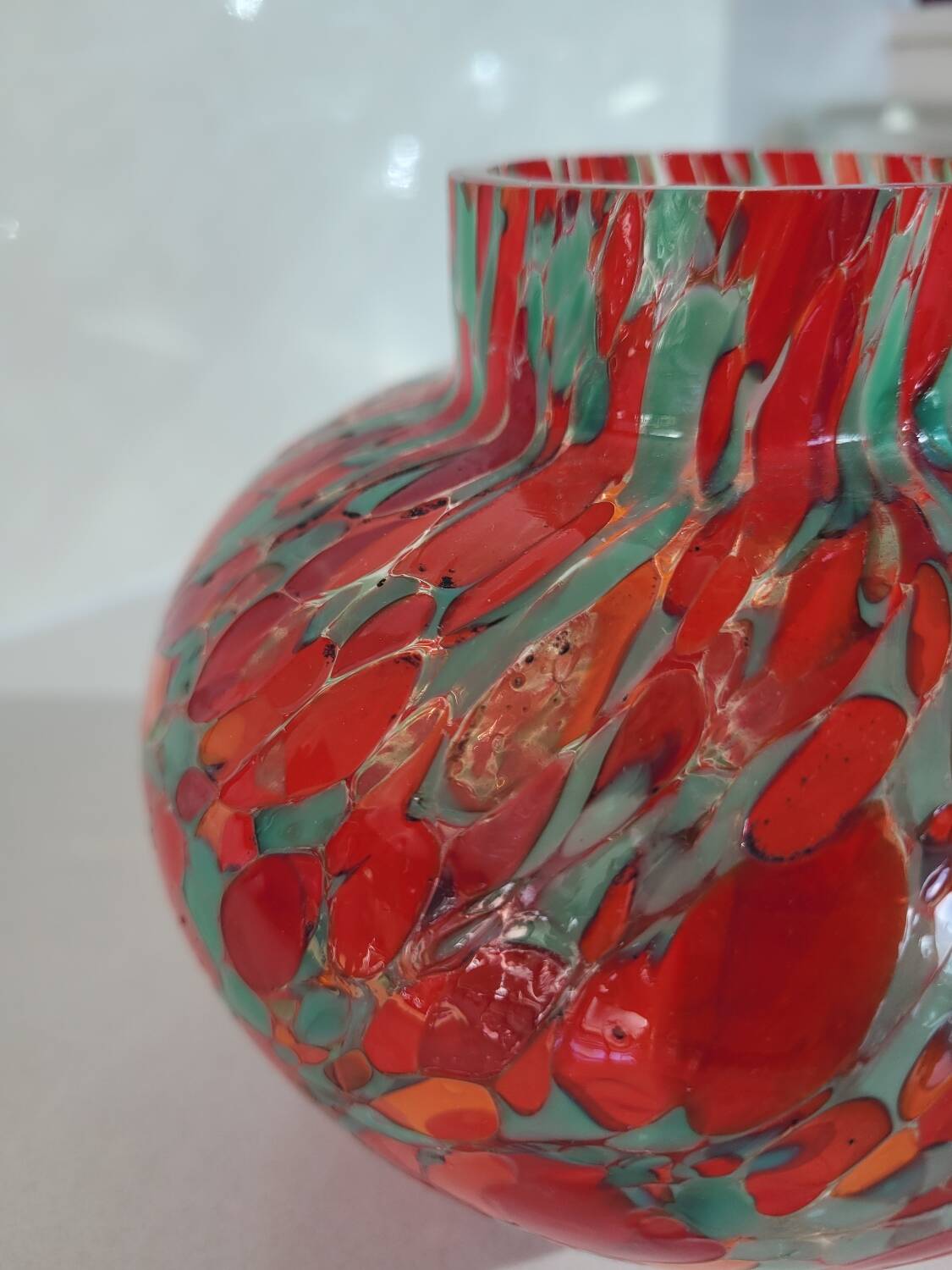 Old multi-colored glass flower vase