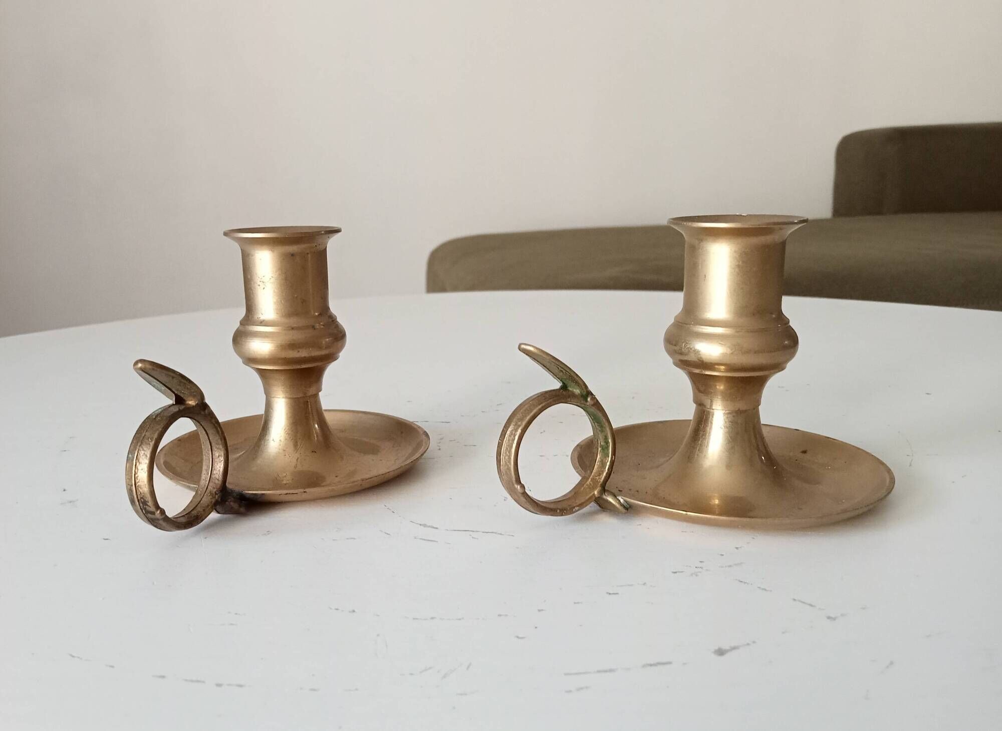 Antique hand candlestick in solid gilded brass.