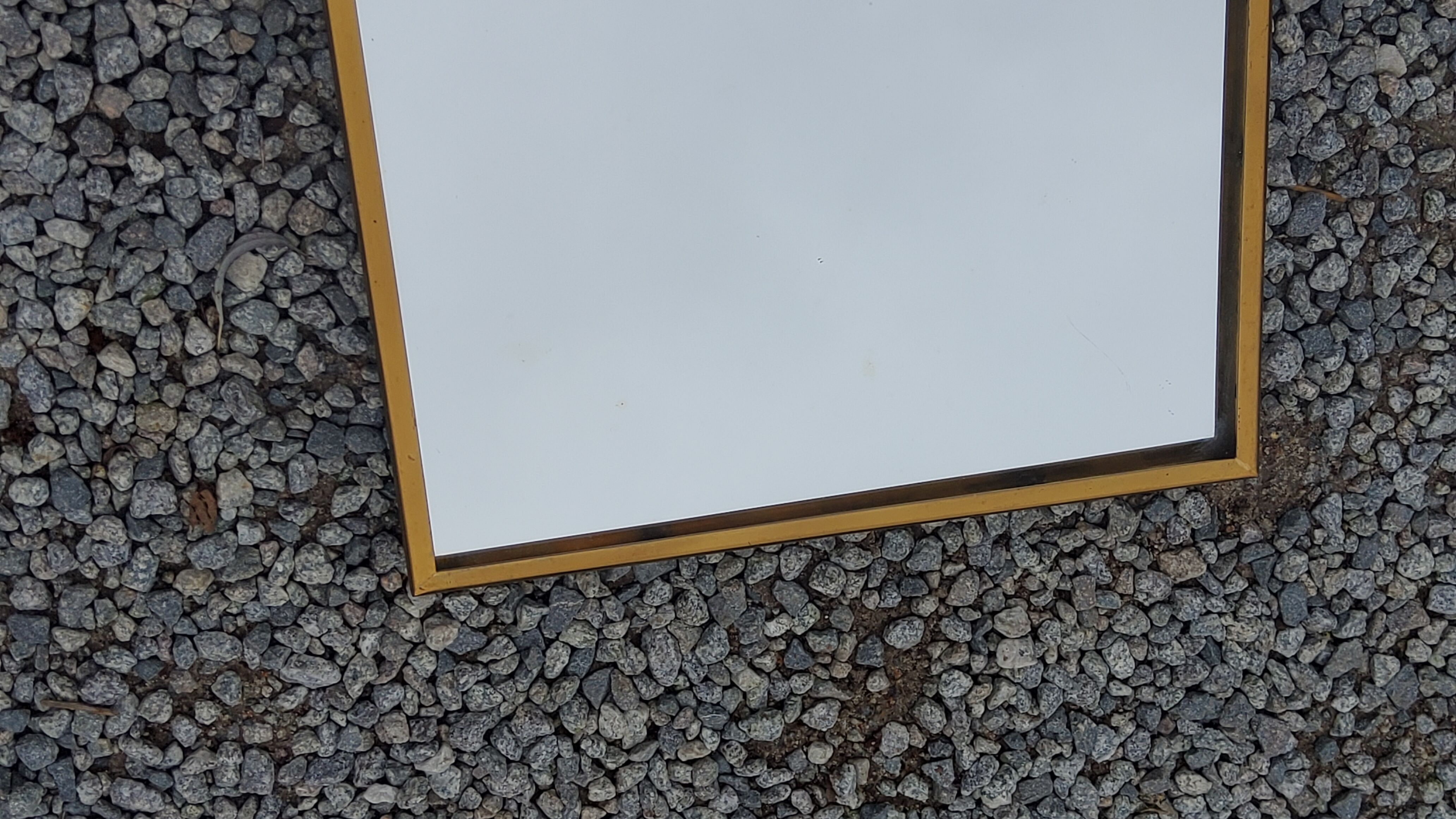 Mirror of the 70s in gilded metal, 60x35 cm