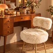 Vintage 1960s dressing table chair with faux fur and golden legs.