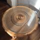 Round coffee table in Louis XV style, with sun cane and glass top.