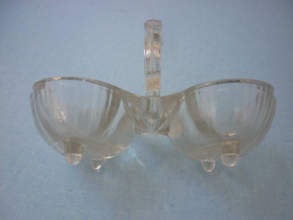 Molded glass salt and pepper service on feet