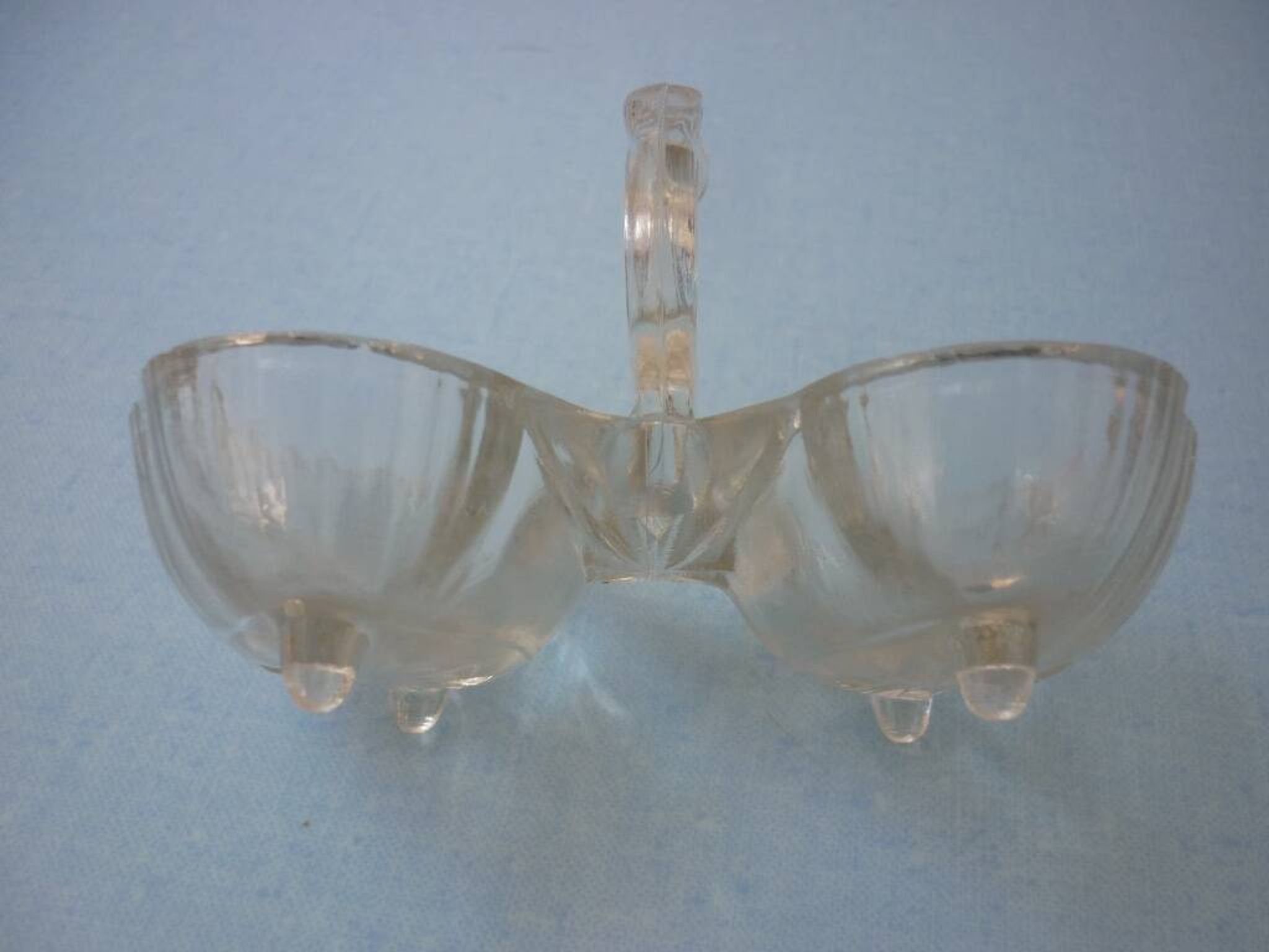 Molded glass salt and pepper service on feet
