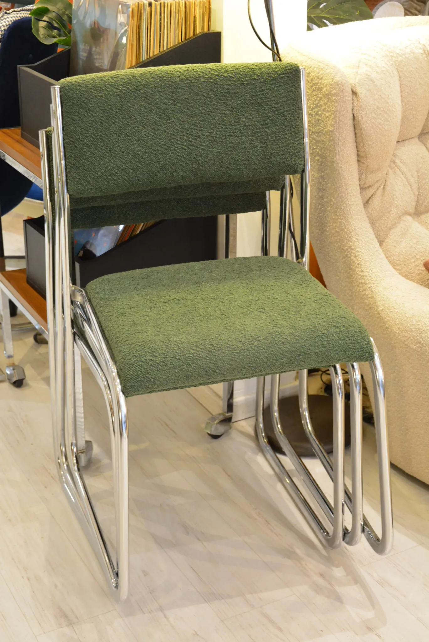 Chrome metal sled chair with green fabric