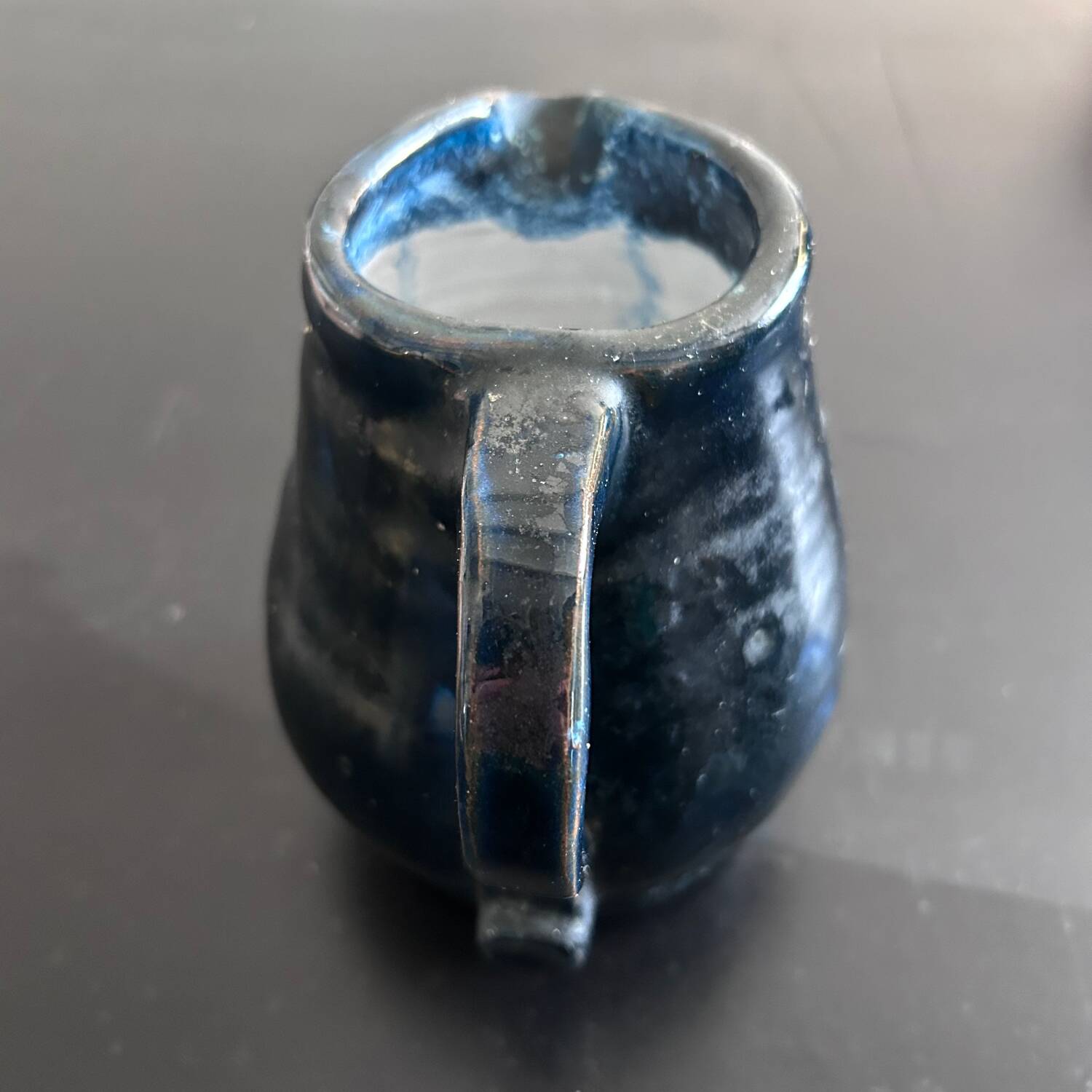 Handcrafted midnight blue pitcher signed