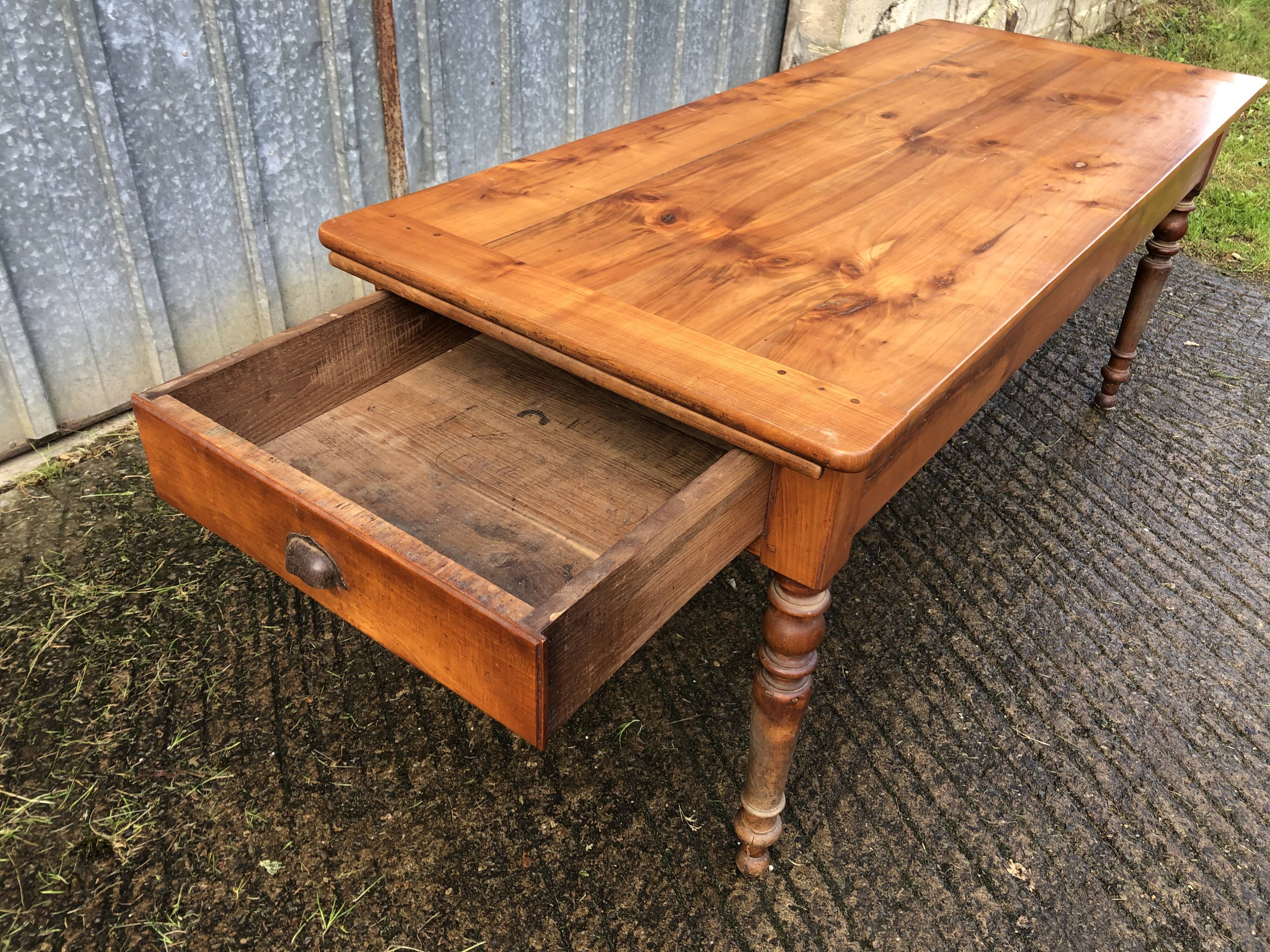 Antique farmhouse table in solid cherry wood in Louis Philippe style.