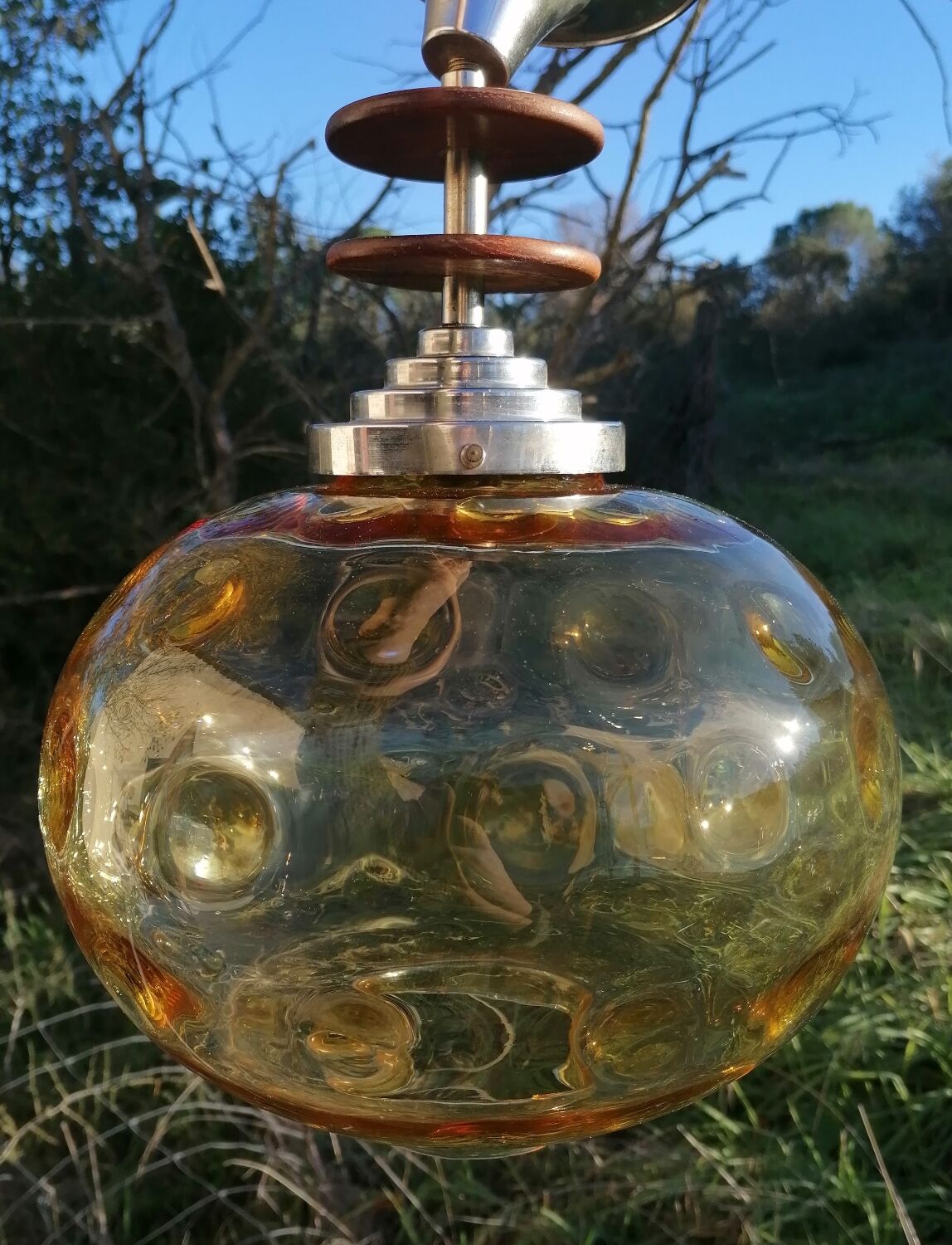 Vintage suspension ball in amber glass