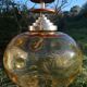 Vintage suspension ball in amber glass