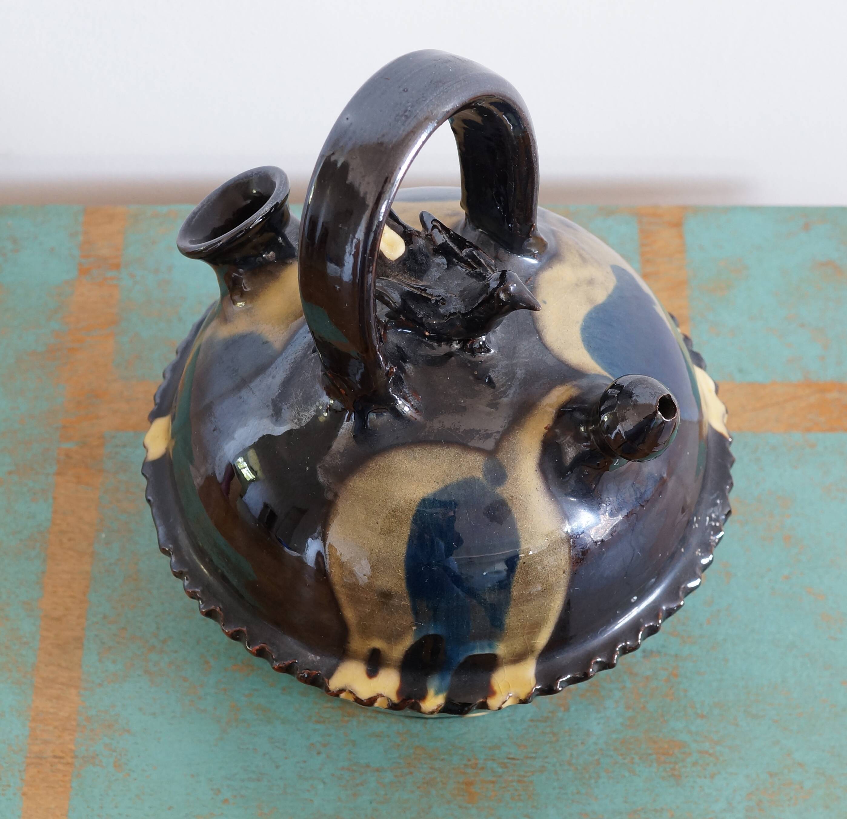 Glazed terracotta gargoulette with bird decoration