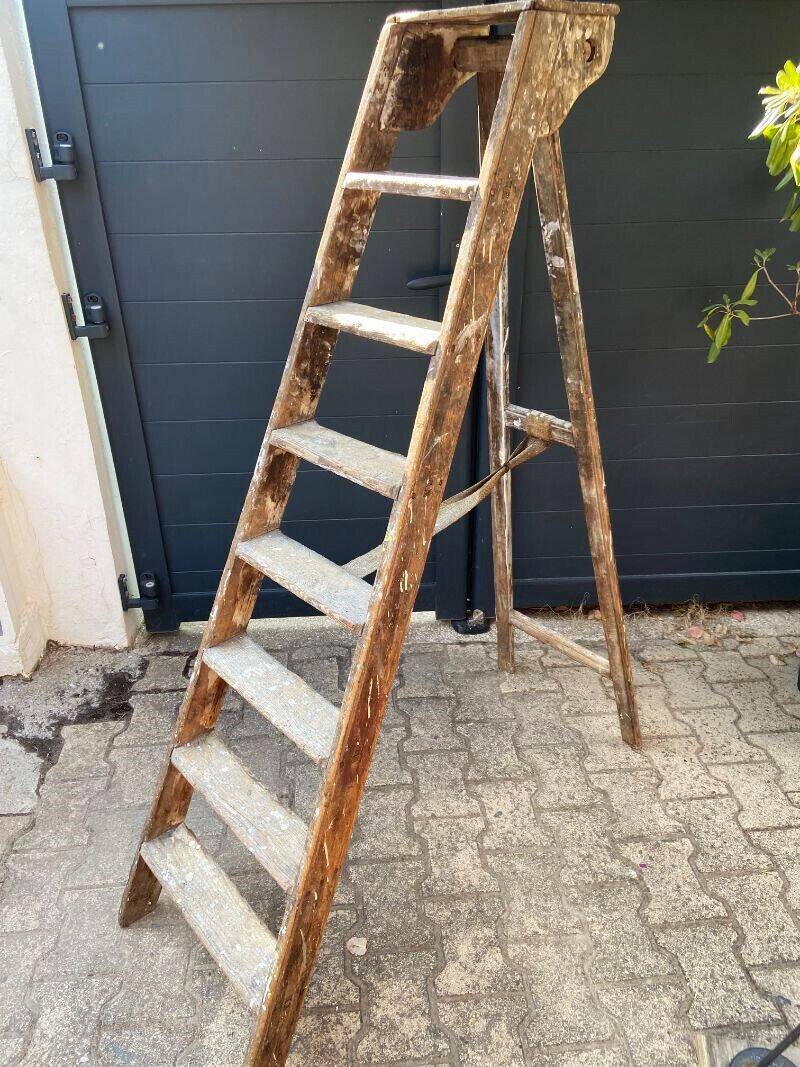 Antique authentic painter's stepladder in vintage patinated wood