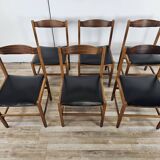 Six Scandinavian-style teak and leather dining chairs