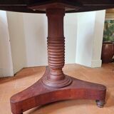 Round table with central tripod leg