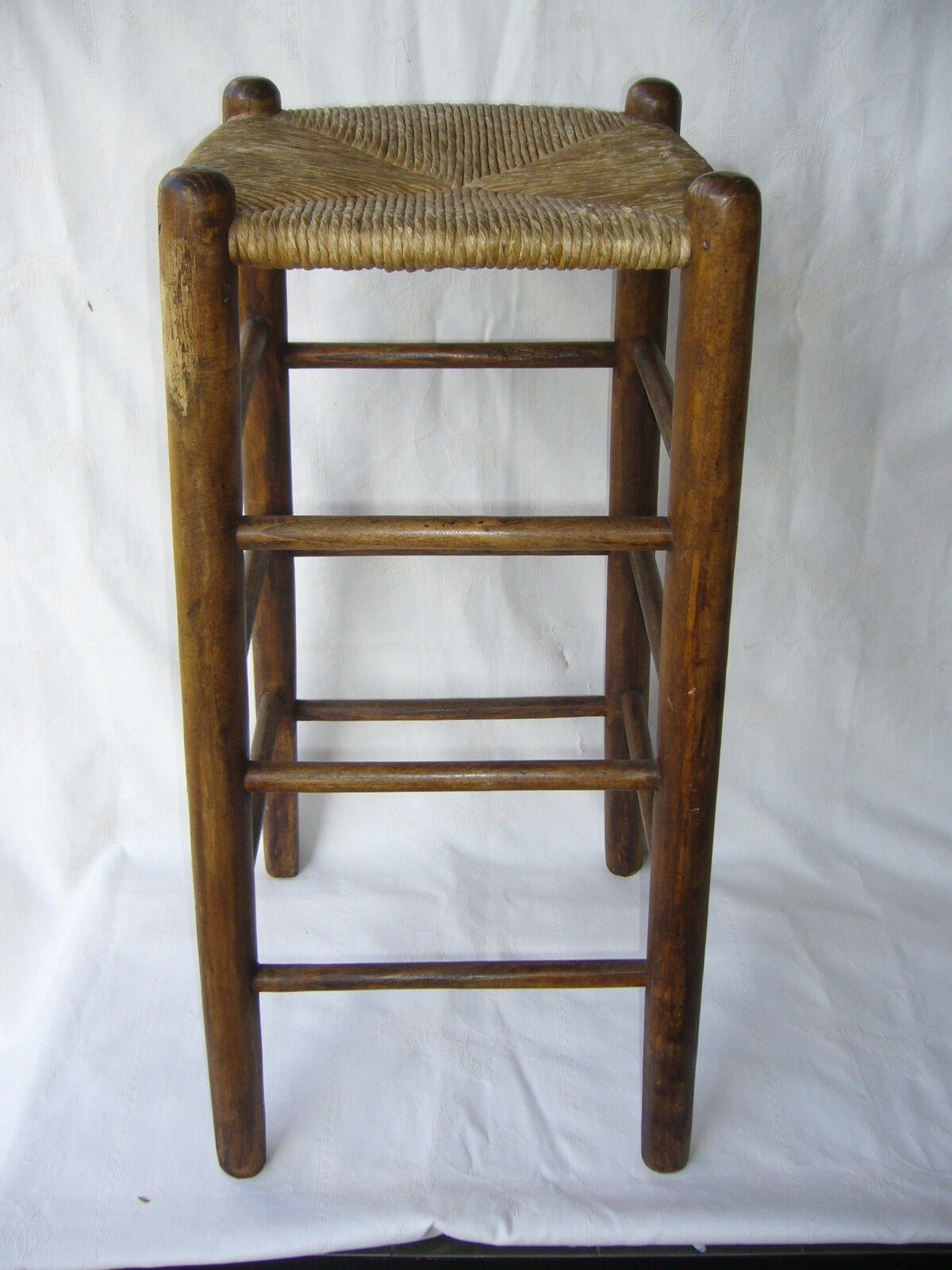 Ancient wooden and straw stool