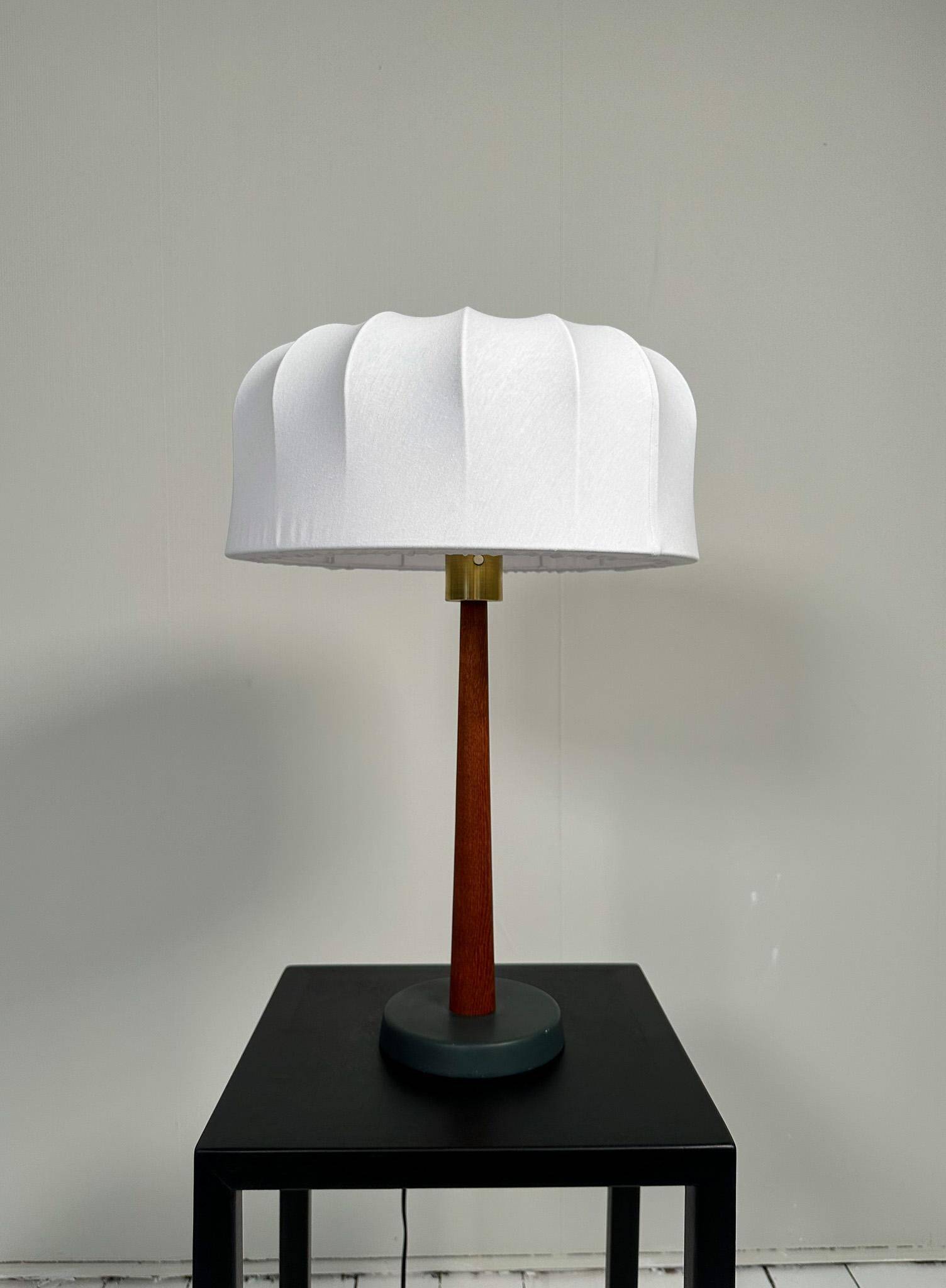 Mid-century teak and cotton table lamp by Einar Bäckström, Sweden, 1950s.