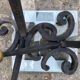 Massive wrought iron chenets from the 19th century topped with brass balls.