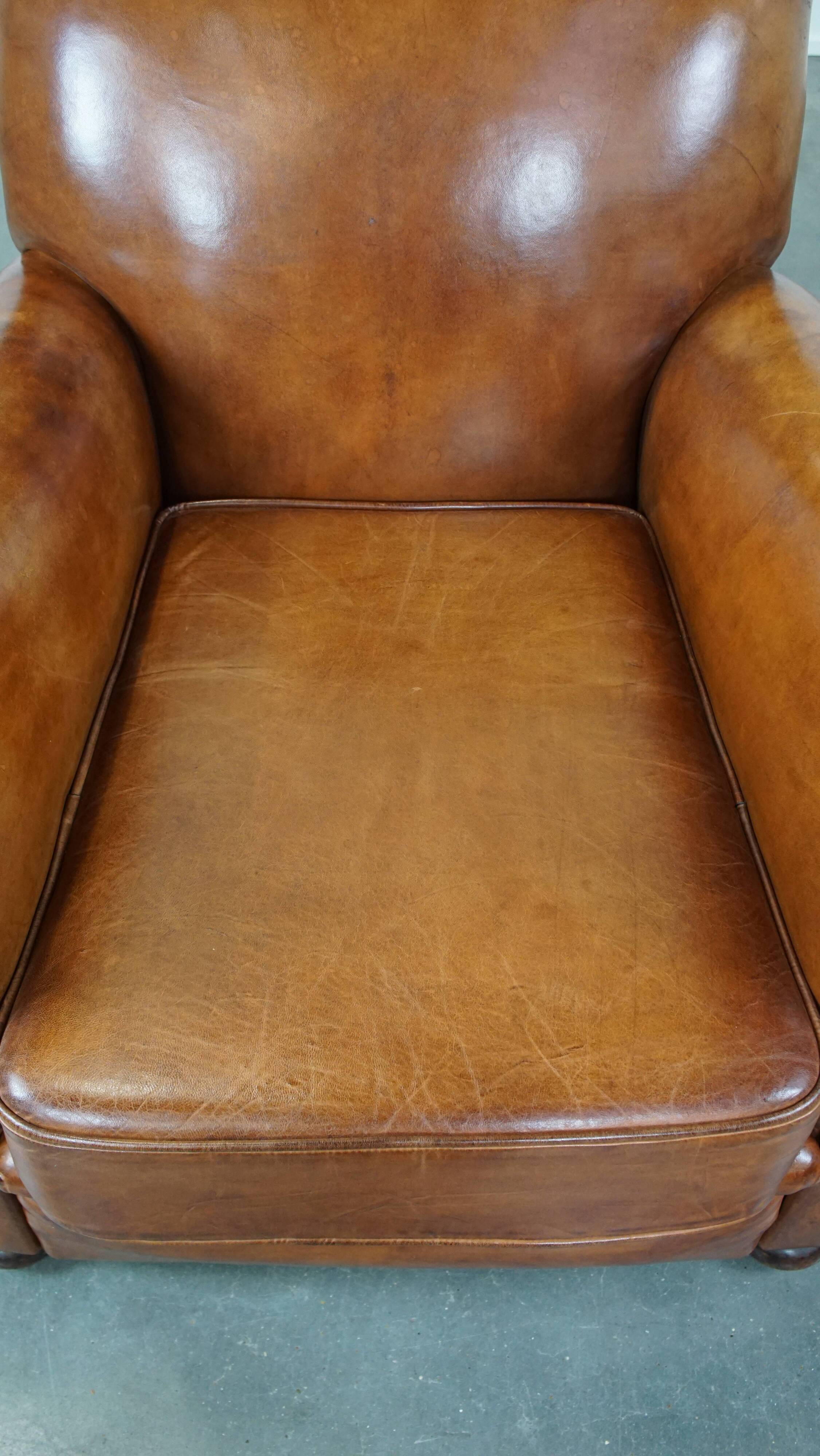 Cognac-colored antique sheep leather armchair
