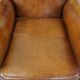 Cognac-colored antique sheep leather armchair