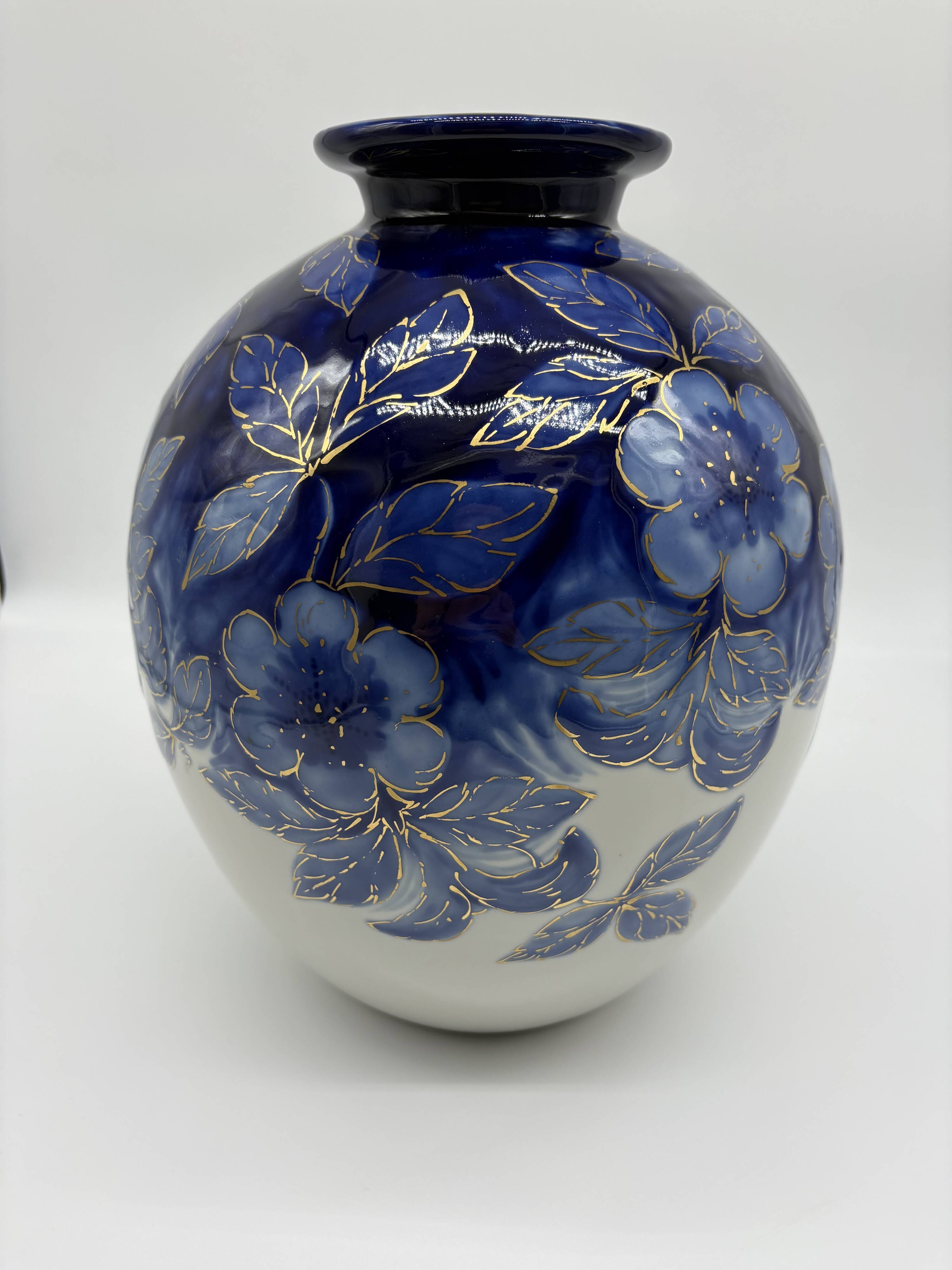 Large Tharaud Limoges vase in cobalt blue porcelain with floral decoration.
