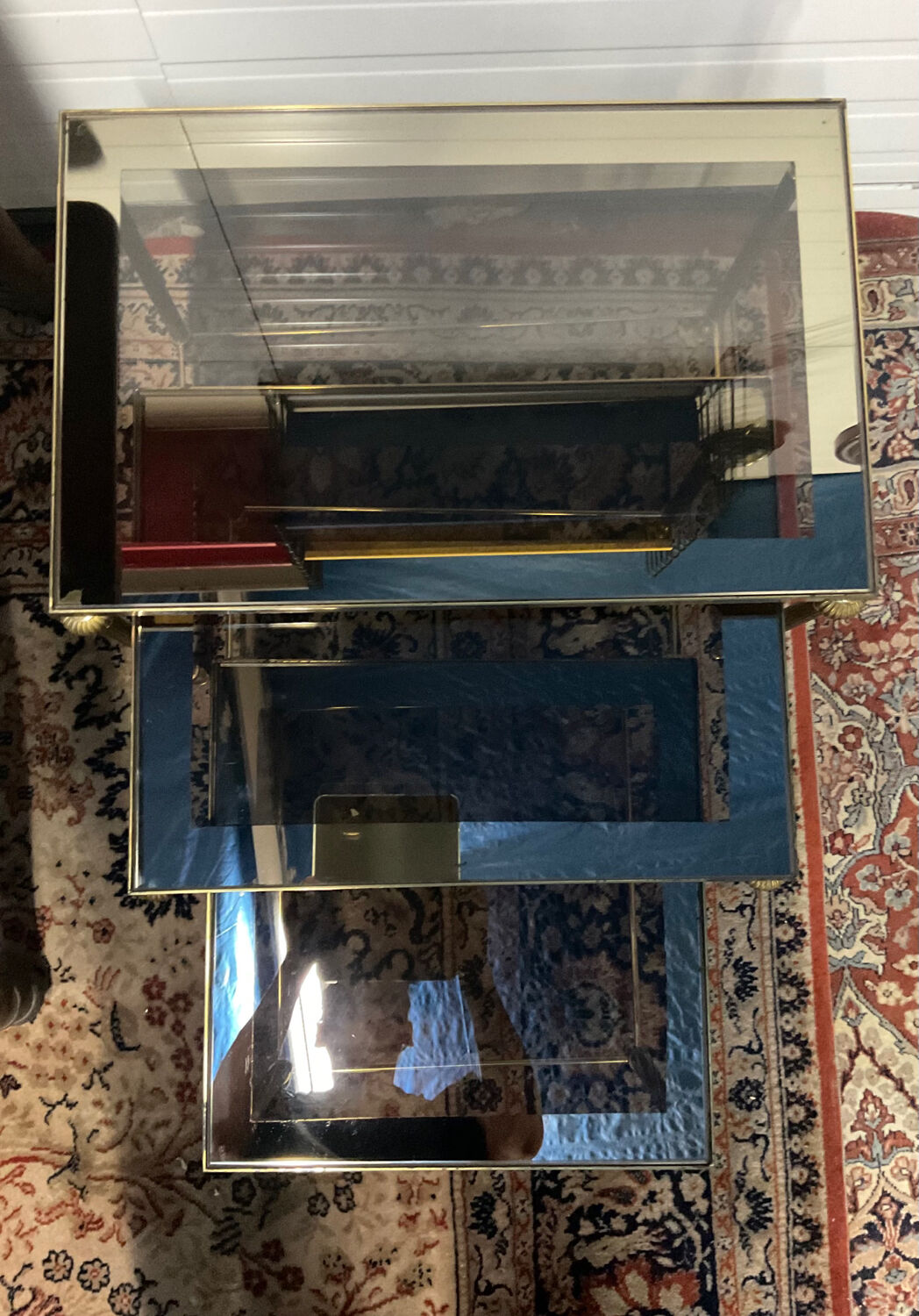 Series of 3 empire style nesting tables in brass and glass