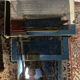 Series of 3 empire style nesting tables in brass and glass