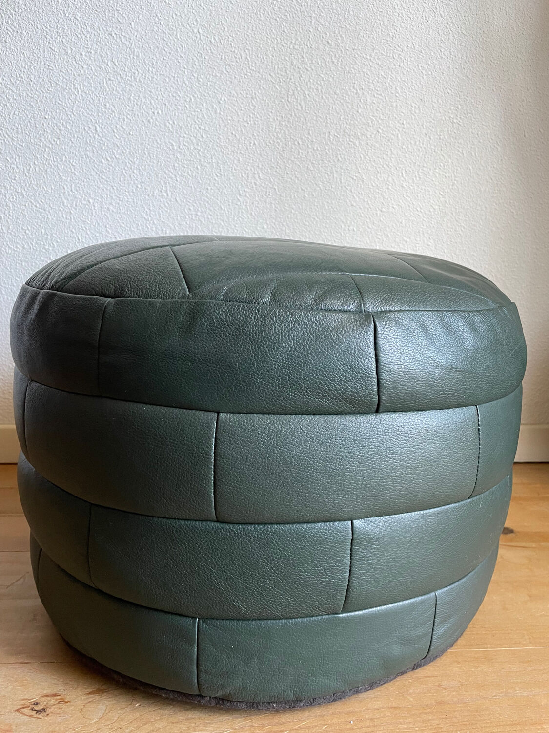 Green patchwork leather pouf from Sède