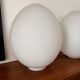 Two opal glass egg lamps