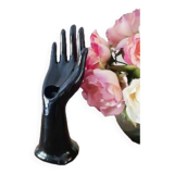 Hand holds black jewelry, ring sizer, soliflore, vintage French, 50s