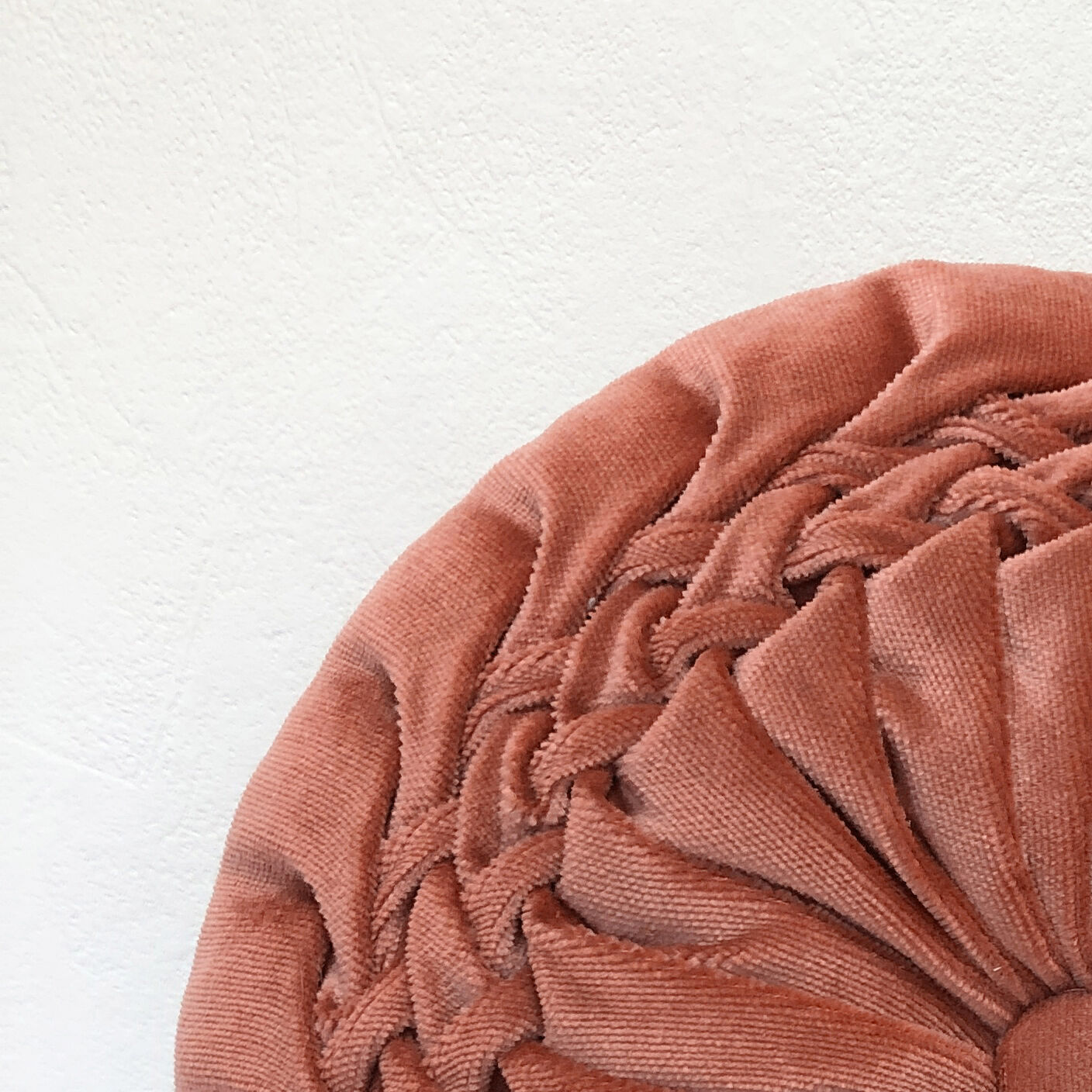 Round orange velvet cushion