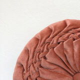 Round orange velvet cushion