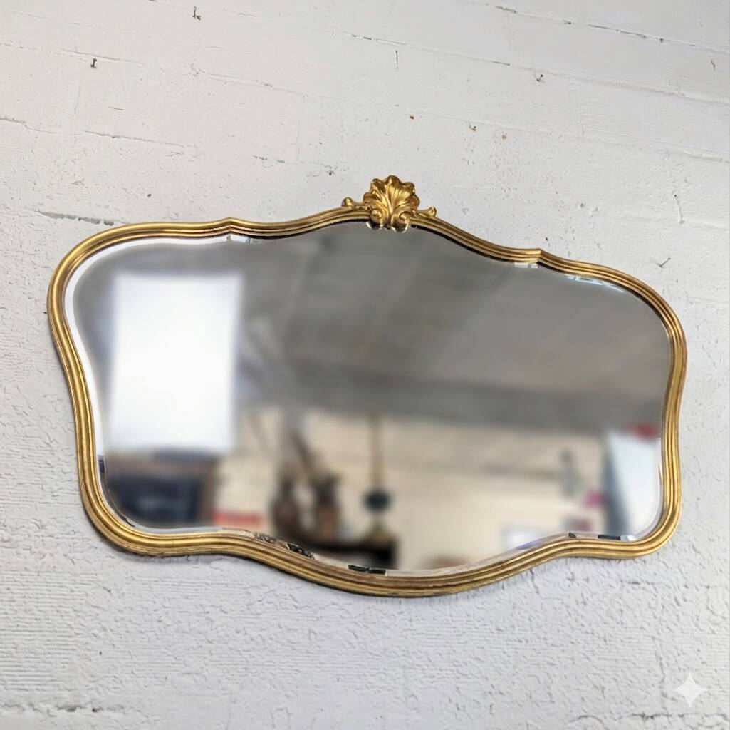 Louis-Philippe gilded mirror with shell pediment
