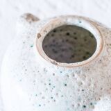 Old foam-glazed terracotta vase