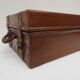Rectangular wooden suitcase covered with leather