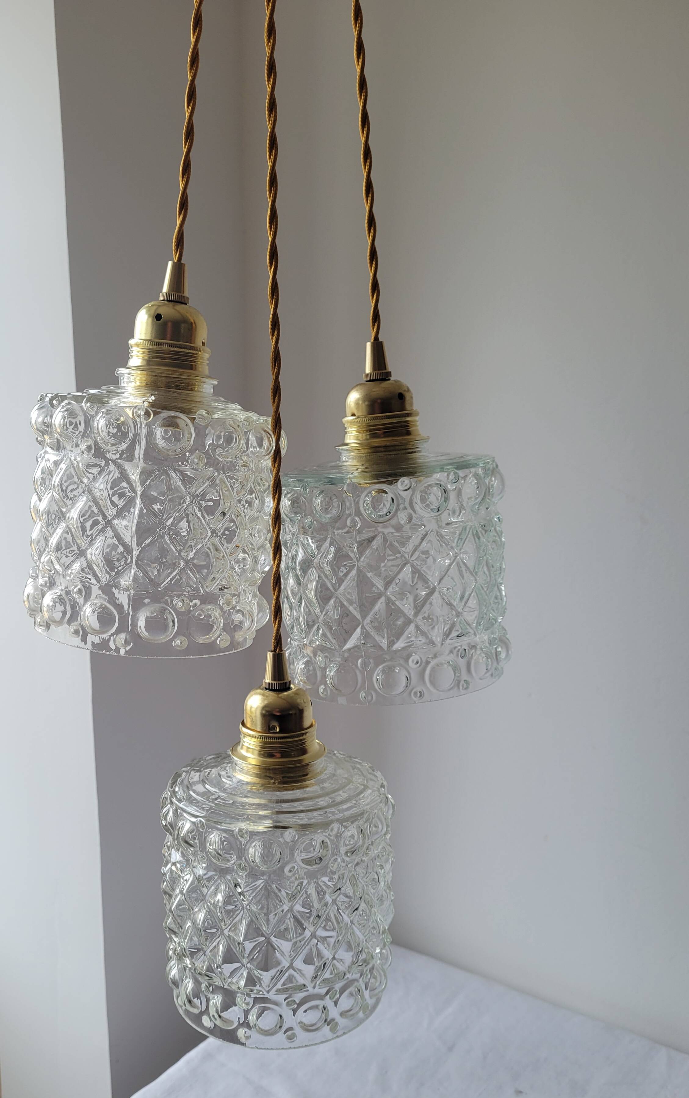 Trio of molded glass pendant lights