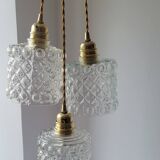 Trio of molded glass pendant lights