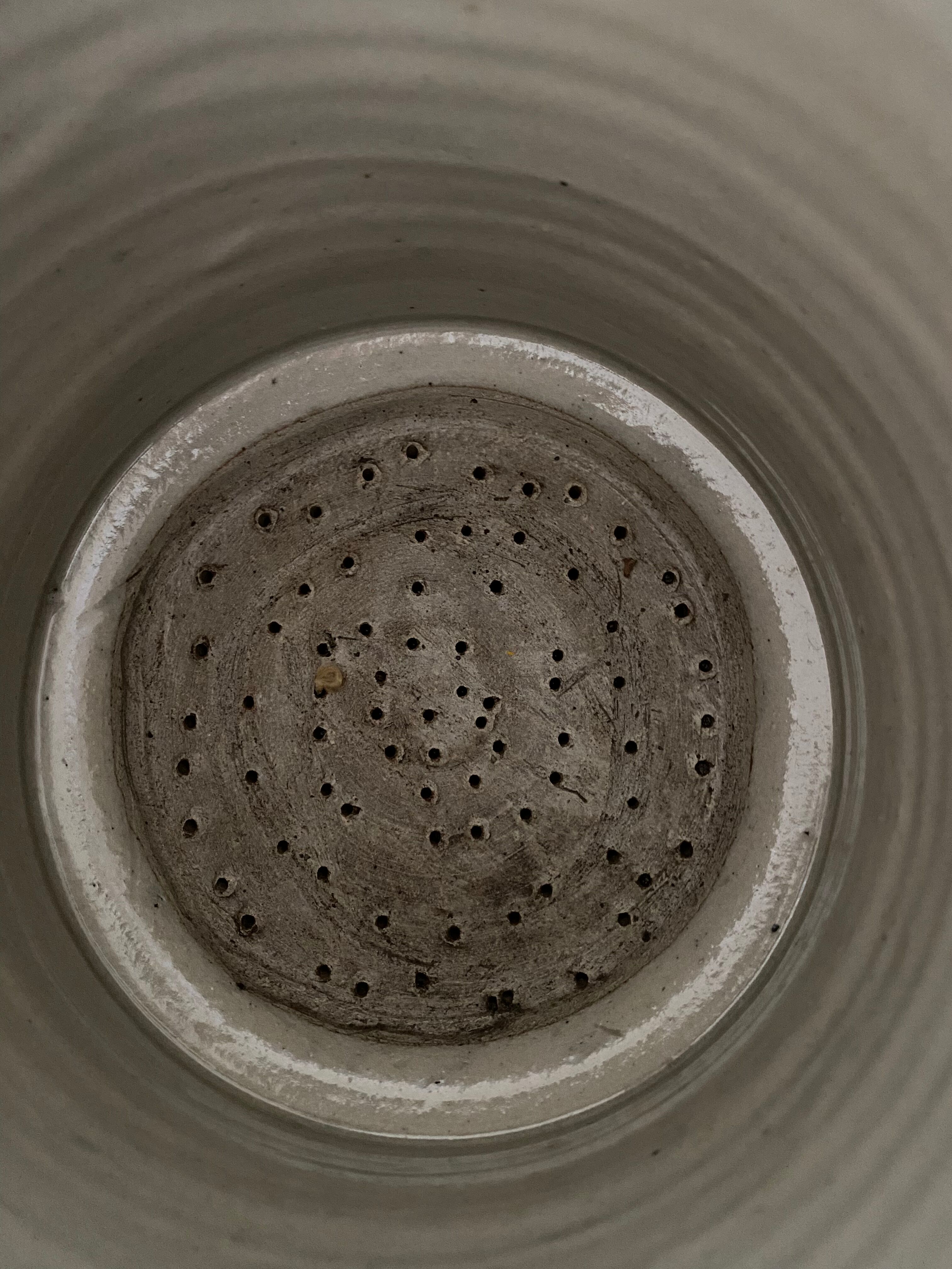 Old pot, sandstone, blue flower decoration
