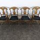 Serie de 4 fauteuils de style directoire à dossier en palmette