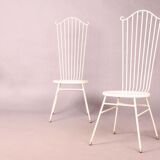 Two white metal chairs